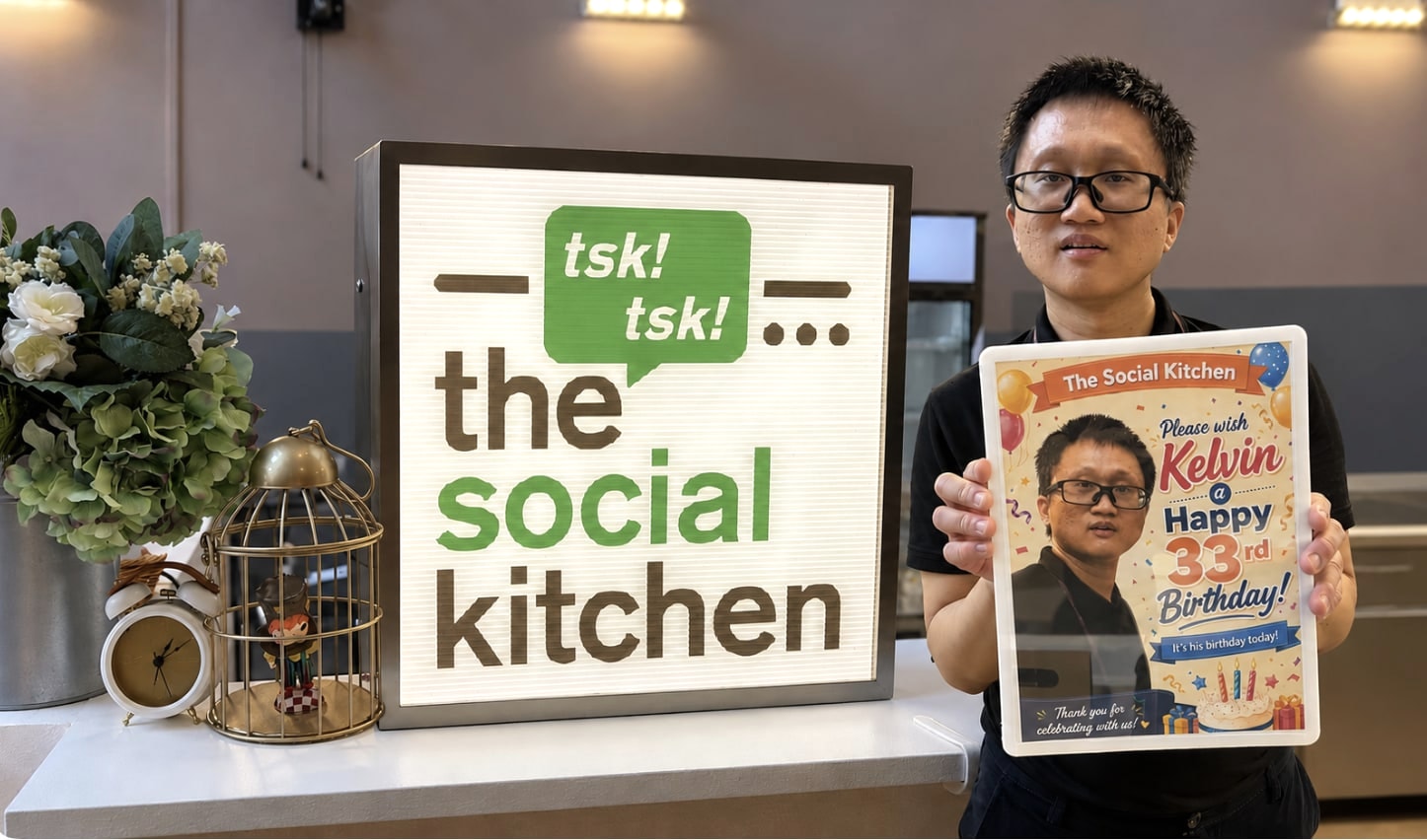 A birthday celebration beside The Social Kitchen sign at Serangoon Polyclinic