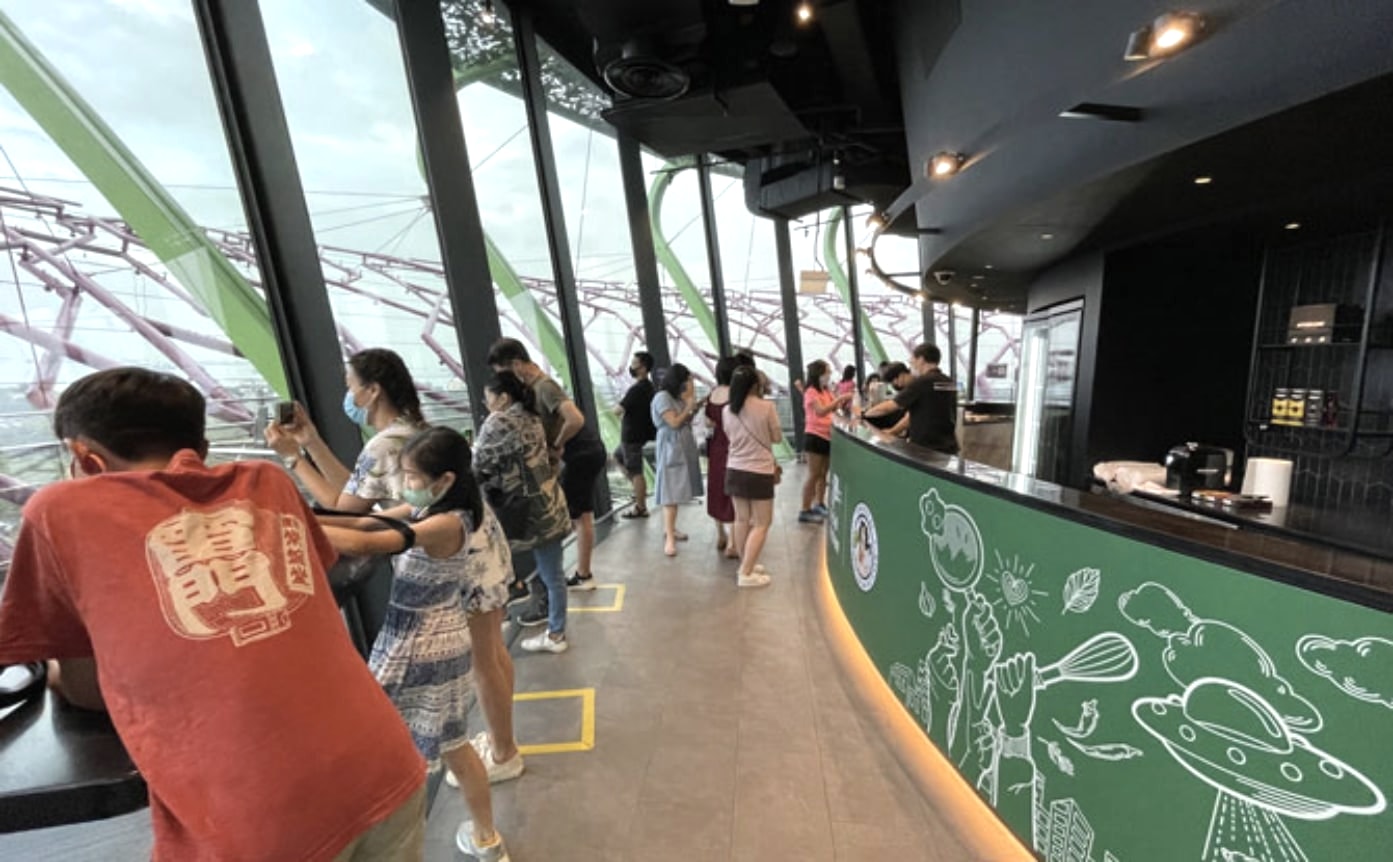 Visitors beside The Social Kitchen café counter at Supertree Observatory, Gardens by the Bay